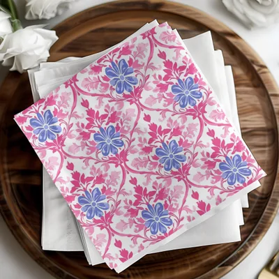 White napkins with pink and blue floral pattern on a wooden tray.