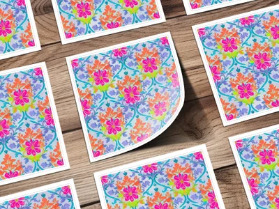 Floral pattern sticker with pink, orange, and blue flowers on wood background.