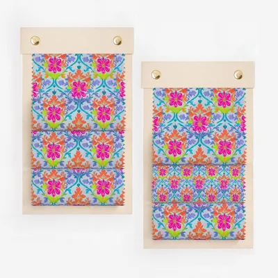 Two fabric swatch displays with colorful floral patterns on a light background.