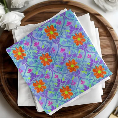 Floral patterned napkins with orange flowers on a light blue background.