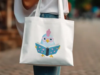 White tote bag with watercolor illustration of a blue chicken wearing glasses reading a book.