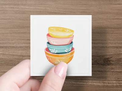 Stack of four colorful ceramic bowls with patterned interiors.