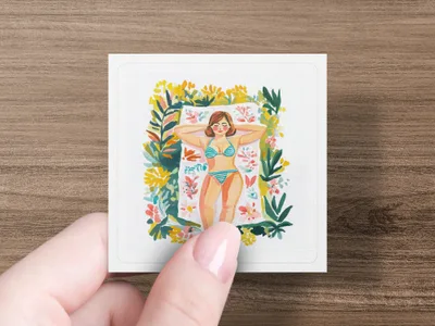 Woman in striped bikini sunbathing on a towel surrounded by flowers.