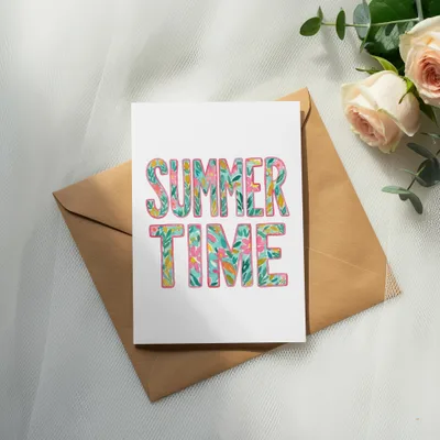 Card with "SUMMER TIME" in floral lettering on a kraft envelope.