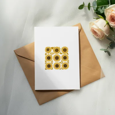 Card with sunflower pattern on envelope, with roses and eucalyptus.