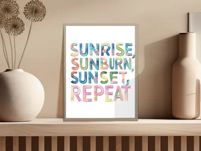 Sunrise, sunburn, repeat in colorful watercolor text on framed art.