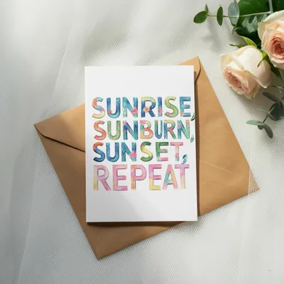 Card with watercolor text "Sunrise, Sunburn, Sunset, Repeat" on envelope.