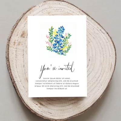 Invitation with floral watercolor and "You're invited" text.