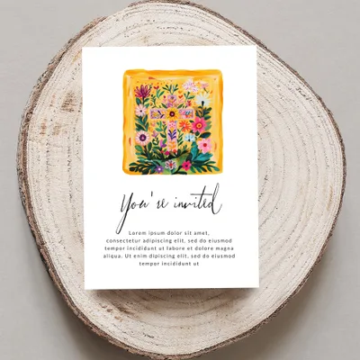 Invitation with floral cross design and "You're invited" text.