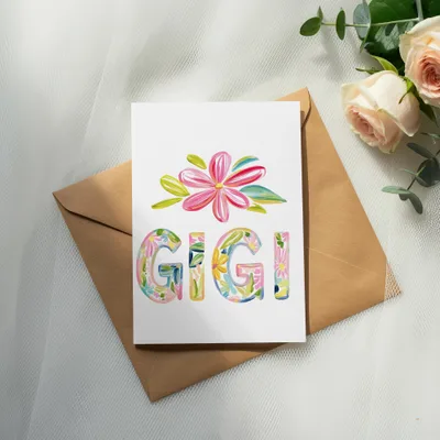 Card with colorful floral letters spelling "GIGI" on an envelope.
