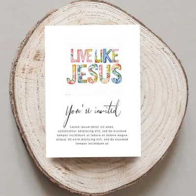 Card with "Live Like Jesus" and invitation text on a wood slice.