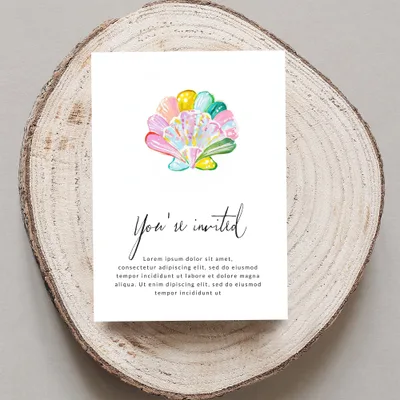 Invitation card with watercolor seashells and "You're invited" text.