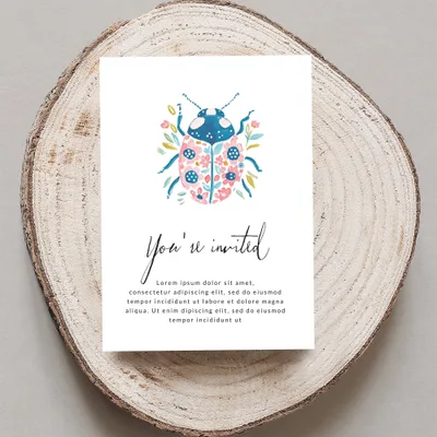 Invitation with a watercolor ladybug design and placeholder text.