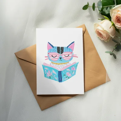 Illustration of a blue cat wearing glasses, reading a book.