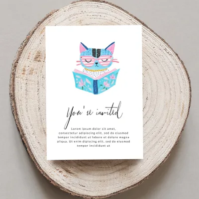 Invitation with a cat reading a book, with "You're invited" text.