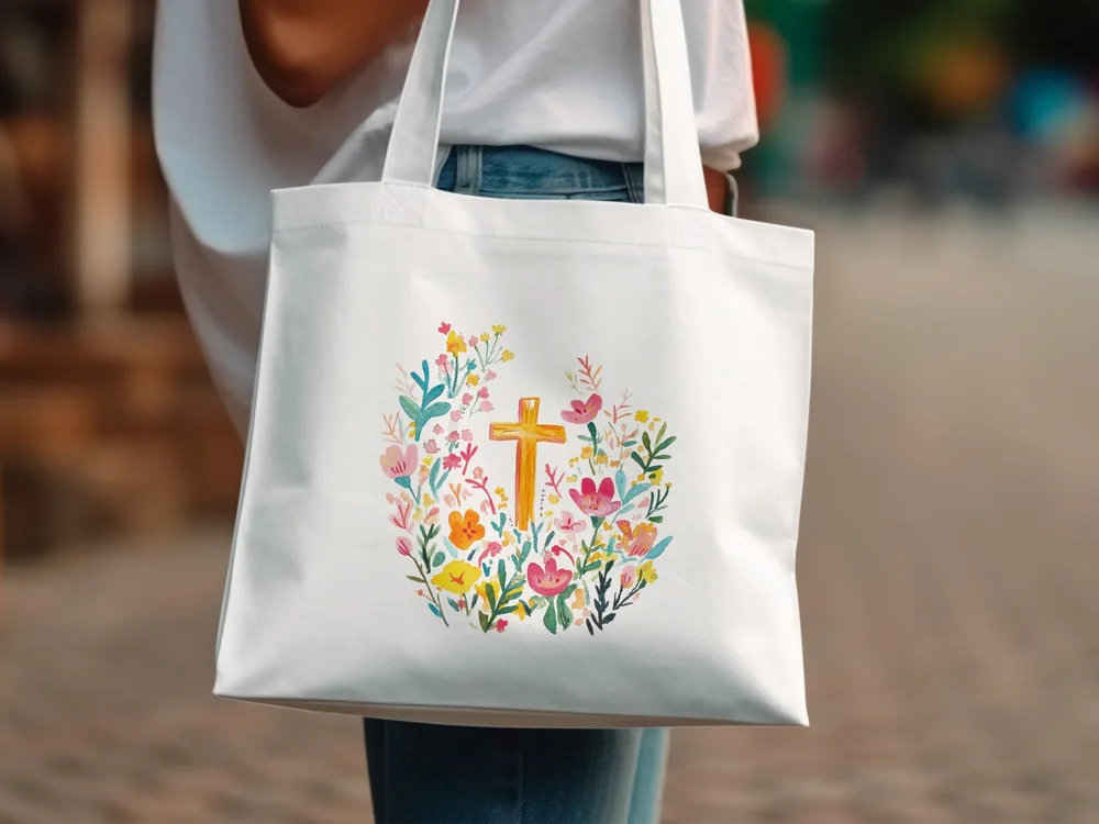White tote bag with a watercolor floral cross design.