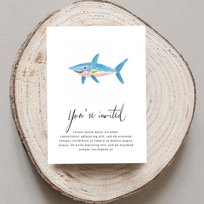 Invitation with a cartoon shark and "You're invited" text.