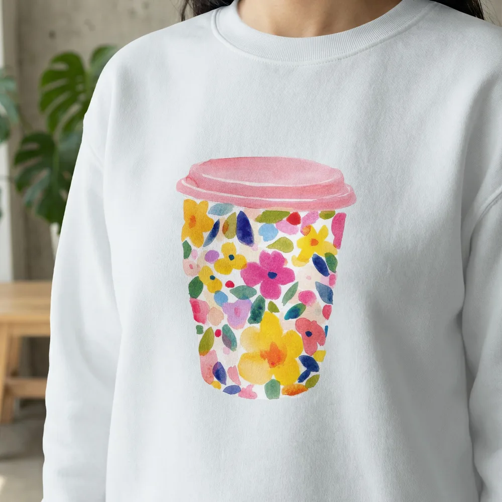 White sweatshirt with a watercolor floral coffee cup design.