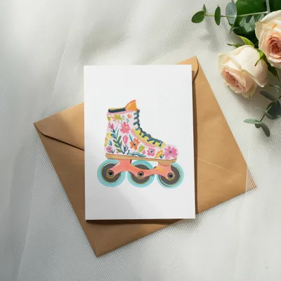 Card with floral roller skate illustration on brown envelope and roses.