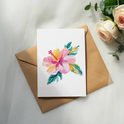 White card with watercolor hibiscus flower on brown envelope.