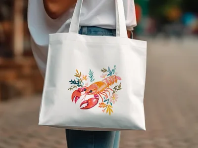 White canvas tote bag with lobster and floral watercolor graphic.
