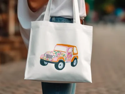 White tote bag with colorful floral-patterned Jeep illustration.