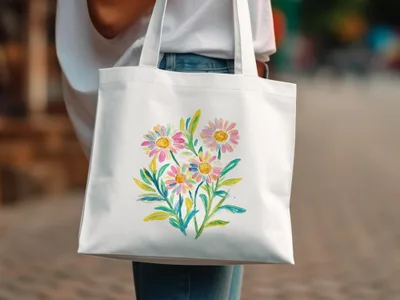 White tote bag with a watercolor floral bouquet featuring daisies and greenery.