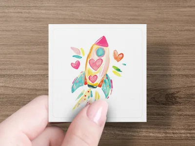 Colorful rocket with hearts, emitting streamers and sparkles.