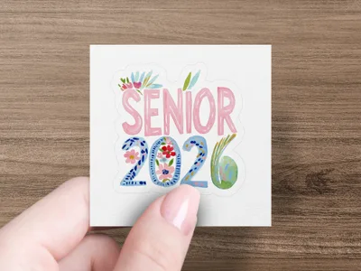 Pink "SENIOR 2026" text with floral accents, held by a hand.