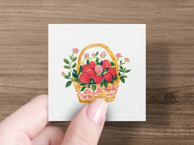 Basket of fresh strawberries with pink flowers and green leaves.