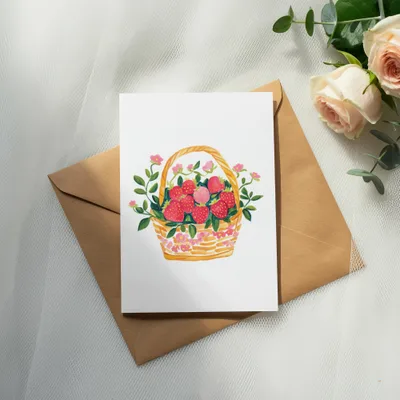 Watercolor illustration of a basket overflowing with strawberries and pink flowers.