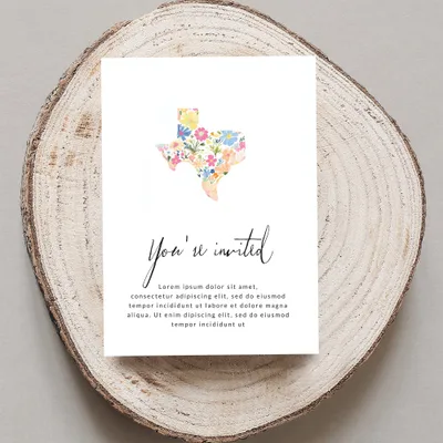 Texas shape invitation with floral pattern and placeholder text.