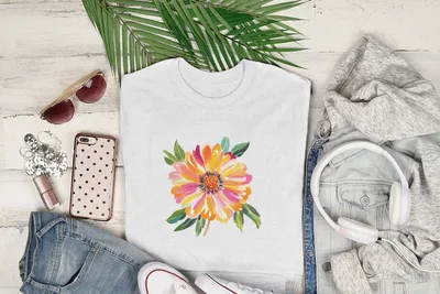 White t-shirt with a vibrant pink, orange, and yellow floral design.