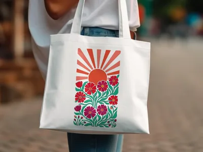 White tote bag with a sun and floral design.