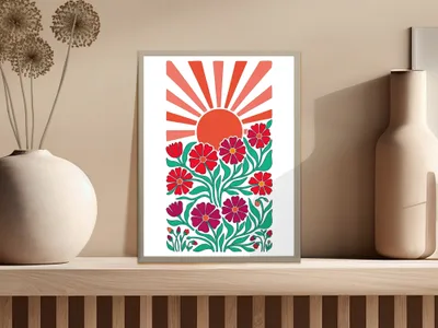 Framed art print with a sunburst and floral design in red and green.