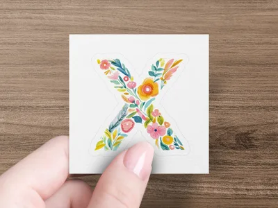Floral letter X sticker with pink, yellow, and blue flowers.
