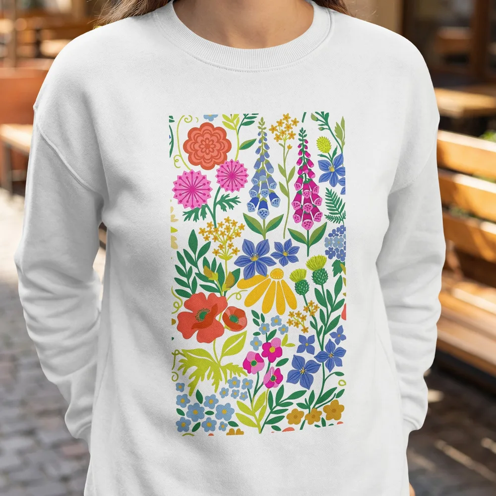 White sweatshirt with a colorful, dense floral pattern.