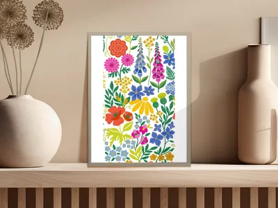 Framed colorful floral art print with various flowers on a shelf.