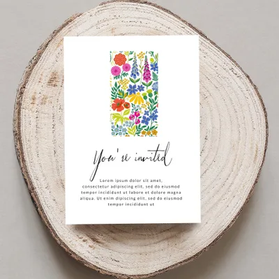 Invitation with floral pattern and "You're invited" text.