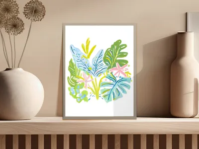Colorful tropical leaves and flowers in a framed art print.