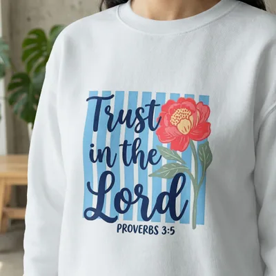 White sweatshirt with "Trust in the Lord" and flower graphic.