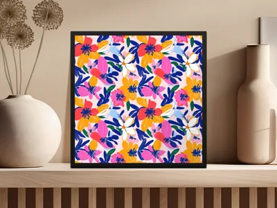 Framed artwork with a colorful floral pattern on a light pink background.