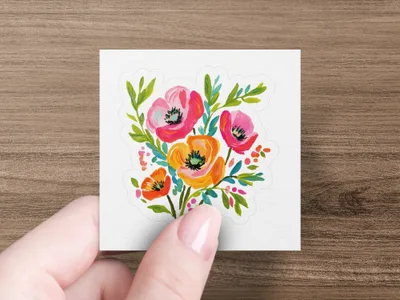 Watercolor bouquet of poppies in pink, orange, and red with green leaves.