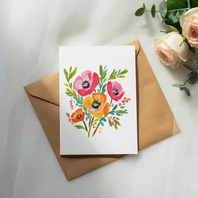 Watercolor floral illustration on a card with a brown envelope.