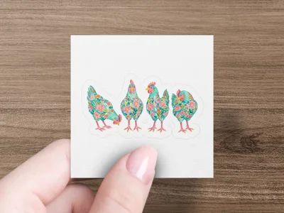 Four colorful, floral-patterned chickens lined up on a white background.