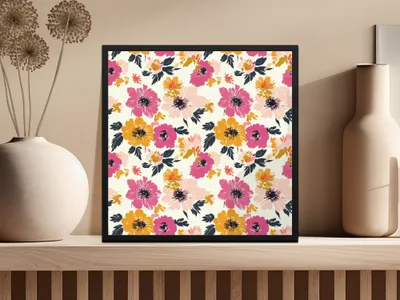 Framed artwork with a colorful floral pattern hangs on a shelf.