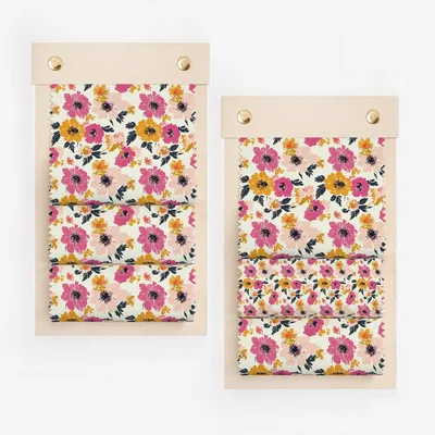 Floral fabric swatches in pink, yellow, and orange on a white background.