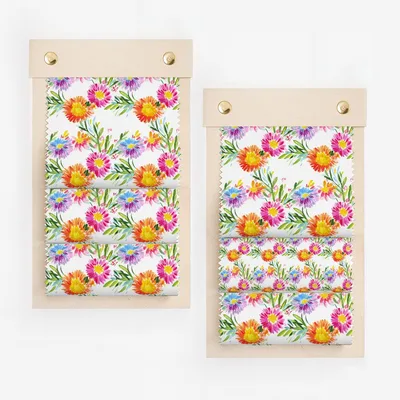 Floral fabric swatches on wooden holders.