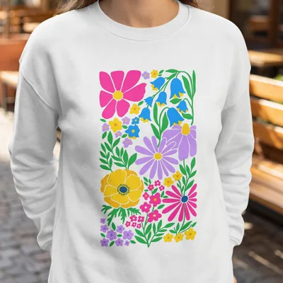 White sweatshirt with a colorful floral art print.