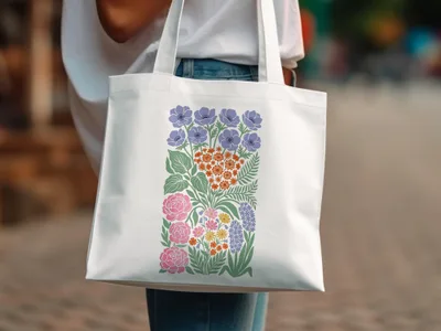 White tote bag with colorful floral illustration.